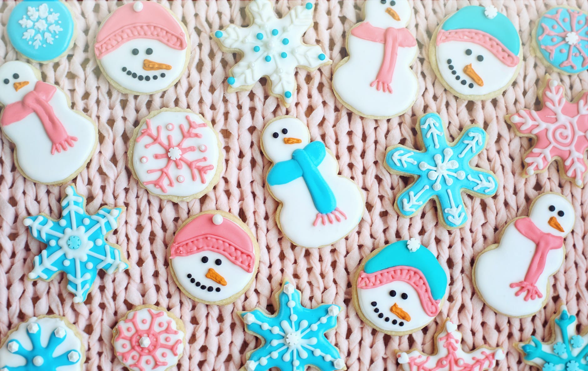 christmas cookies on pink surface