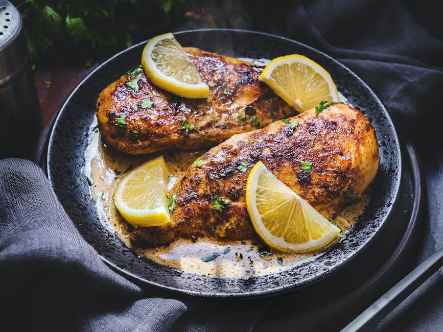 a delicious roasted chicken with lemon slices